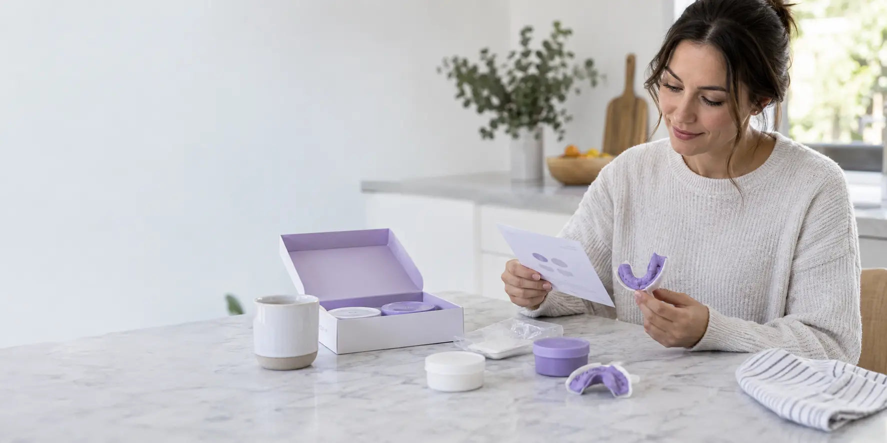 Patient preparing a SmileWide dental impression kit at home