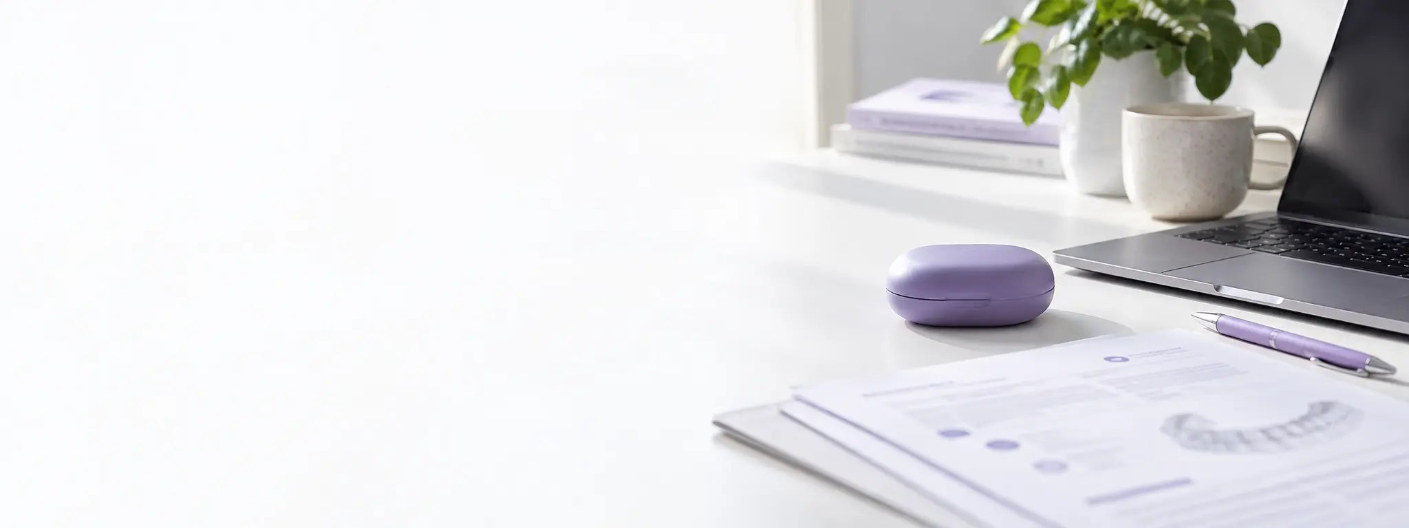 Clear aligner information and product case on a home office desk
