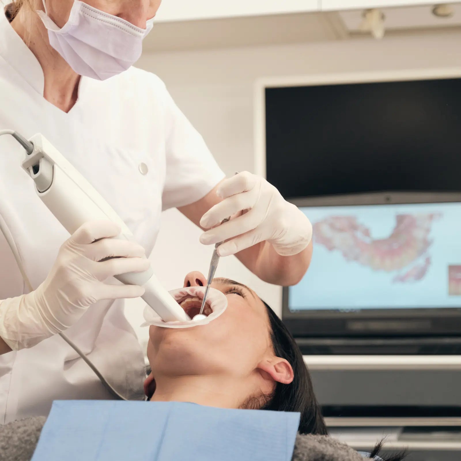 SmileWide customer discussing clear aligner care with a professional